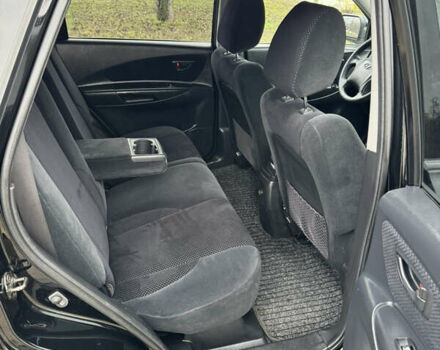 Черный Хендай Туксон, объемом двигателя 2 л и пробегом 201 тыс. км за 7750 $, фото 52 на Automoto.ua