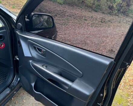 Черный Хендай Туксон, объемом двигателя 2 л и пробегом 210 тыс. км за 7200 $, фото 6 на Automoto.ua