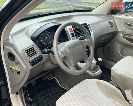 Чорний Хендай Туксон, об'ємом двигуна 1.98 л та пробігом 185 тис. км за 6850 $, фото 11 на Automoto.ua