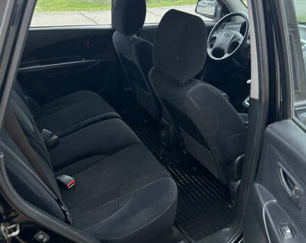 Черный Хендай Туксон, объемом двигателя 1.98 л и пробегом 227 тыс. км за 6900 $, фото 26 на Automoto.ua