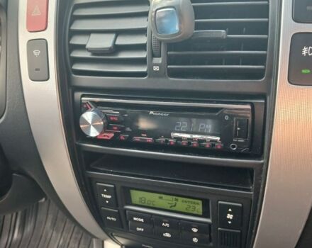 Черный Хендай Туксон, объемом двигателя 2 л и пробегом 266 тыс. км за 7700 $, фото 7 на Automoto.ua