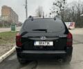 Черный Хендай Туксон, объемом двигателя 2 л и пробегом 174 тыс. км за 8000 $, фото 1 на Automoto.ua