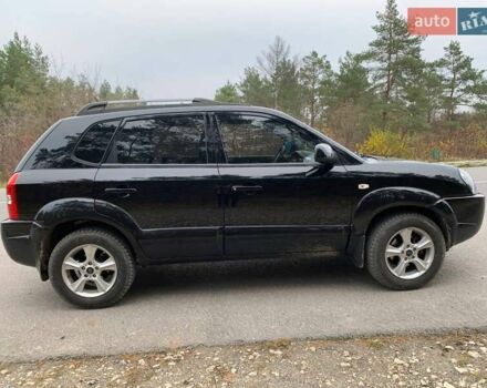 Черный Хендай Туксон, объемом двигателя 1.98 л и пробегом 196 тыс. км за 7700 $, фото 6 на Automoto.ua