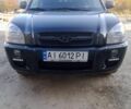 Черный Хендай Туксон, объемом двигателя 2 л и пробегом 203 тыс. км за 7500 $, фото 1 на Automoto.ua