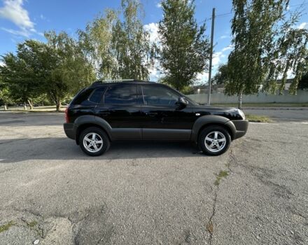 Черный Хендай Туксон, объемом двигателя 2 л и пробегом 249 тыс. км за 5800 $, фото 7 на Automoto.ua
