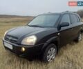 Черный Хендай Туксон, объемом двигателя 1.98 л и пробегом 216 тыс. км за 7500 $, фото 1 на Automoto.ua