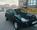 Черный Хендай Туксон, объемом двигателя 1.98 л и пробегом 230 тыс. км за 7200 $, фото 1 на Automoto.ua