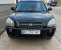 Черный Хендай Туксон, объемом двигателя 2 л и пробегом 178 тыс. км за 7700 $, фото 1 на Automoto.ua
