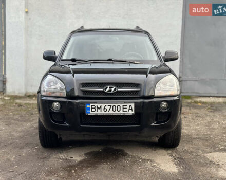 Черный Хендай Туксон, объемом двигателя 1.98 л и пробегом 198 тыс. км за 7500 $, фото 6 на Automoto.ua