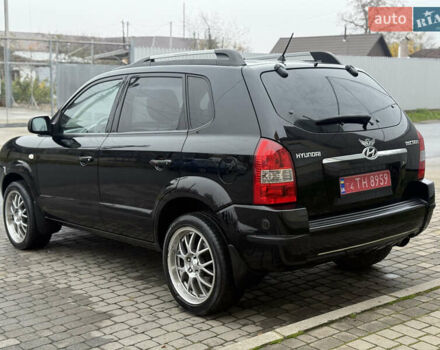 Черный Хендай Туксон, объемом двигателя 1.98 л и пробегом 231 тыс. км за 7750 $, фото 6 на Automoto.ua