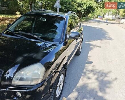 Черный Хендай Туксон, объемом двигателя 2 л и пробегом 247 тыс. км за 6300 $, фото 7 на Automoto.ua