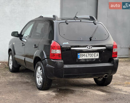 Черный Хендай Туксон, объемом двигателя 1.98 л и пробегом 198 тыс. км за 7500 $, фото 2 на Automoto.ua