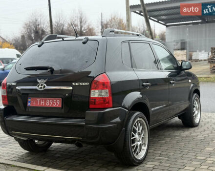 Черный Хендай Туксон, объемом двигателя 1.98 л и пробегом 231 тыс. км за 7750 $, фото 5 на Automoto.ua