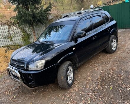 Черный Хендай Туксон, объемом двигателя 2 л и пробегом 210 тыс. км за 7200 $, фото 1 на Automoto.ua