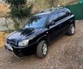 Черный Хендай Туксон, объемом двигателя 2 л и пробегом 210 тыс. км за 7200 $, фото 1 на Automoto.ua