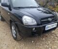 Черный Хендай Туксон, объемом двигателя 2 л и пробегом 230 тыс. км за 6800 $, фото 3 на Automoto.ua