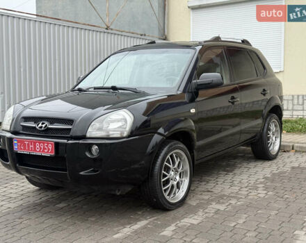 Черный Хендай Туксон, объемом двигателя 1.98 л и пробегом 231 тыс. км за 7750 $, фото 2 на Automoto.ua
