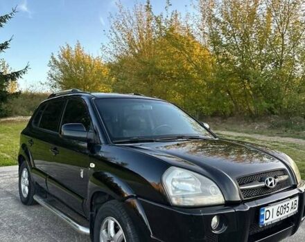 Черный Хендай Туксон, объемом двигателя 2 л и пробегом 235 тыс. км за 6700 $, фото 14 на Automoto.ua