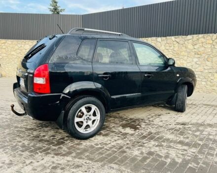 Черный Хендай Туксон, объемом двигателя 2 л и пробегом 310 тыс. км за 6600 $, фото 4 на Automoto.ua