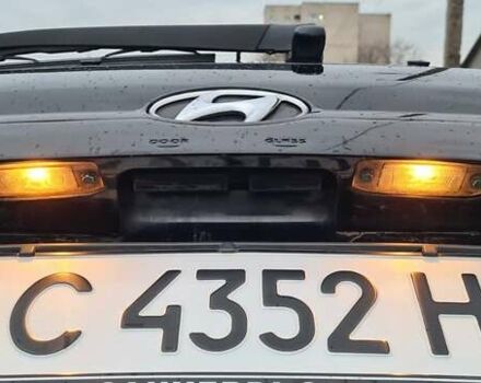 Черный Хендай Туксон, объемом двигателя 1.98 л и пробегом 277 тыс. км за 5350 $, фото 22 на Automoto.ua