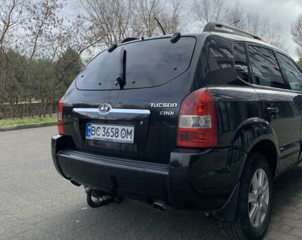 Черный Хендай Туксон, объемом двигателя 1.99 л и пробегом 290 тыс. км за 7700 $, фото 2 на Automoto.ua