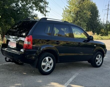 Черный Хендай Туксон, объемом двигателя 2 л и пробегом 266 тыс. км за 7700 $, фото 4 на Automoto.ua