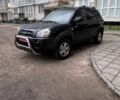 Черный Хендай Туксон, объемом двигателя 2 л и пробегом 235 тыс. км за 8000 $, фото 1 на Automoto.ua