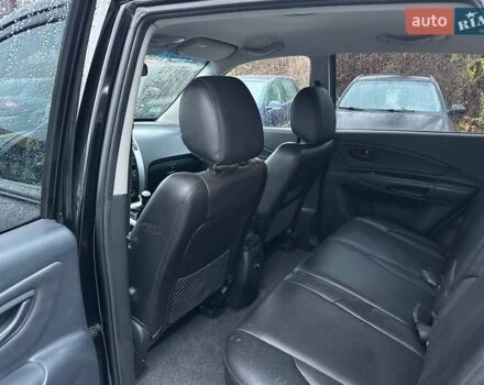 Чорний Хендай Туксон, об'ємом двигуна 2 л та пробігом 167 тис. км за 7950 $, фото 9 на Automoto.ua