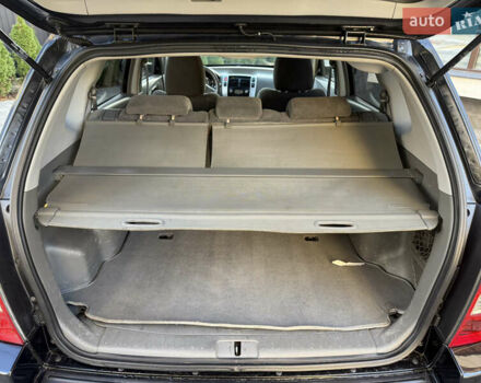 Черный Хендай Туксон, объемом двигателя 2 л и пробегом 249 тыс. км за 7450 $, фото 26 на Automoto.ua