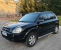 Чорний Хендай Туксон, об'ємом двигуна 2 л та пробігом 235 тис. км за 6700 $, фото 3 на Automoto.ua