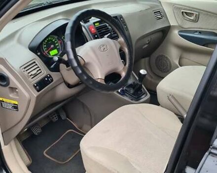 Черный Хендай Туксон, объемом двигателя 1.98 л и пробегом 277 тыс. км за 5350 $, фото 26 на Automoto.ua