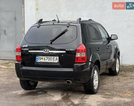 Черный Хендай Туксон, объемом двигателя 1.98 л и пробегом 198 тыс. км за 7500 $, фото 4 на Automoto.ua