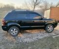 Черный Хендай Туксон, объемом двигателя 2 л и пробегом 180 тыс. км за 7400 $, фото 1 на Automoto.ua