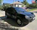 Черный Хендай Туксон, объемом двигателя 2 л и пробегом 255 тыс. км за 7150 $, фото 6 на Automoto.ua