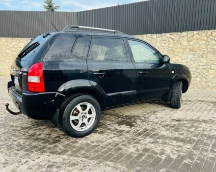 Черный Хендай Туксон, объемом двигателя 2 л и пробегом 310 тыс. км за 6600 $, фото 3 на Automoto.ua