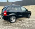 Черный Хендай Туксон, объемом двигателя 2 л и пробегом 310 тыс. км за 6600 $, фото 3 на Automoto.ua
