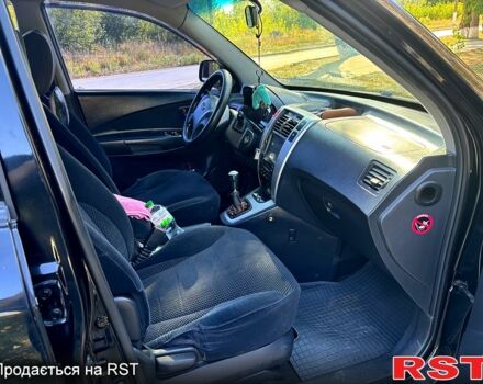 Чорний Хендай Туксон, об'ємом двигуна 2 л та пробігом 274 тис. км за 7300 $, фото 1 на Automoto.ua