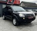 Черный Хендай Туксон, объемом двигателя 2 л и пробегом 163 тыс. км за 8400 $, фото 1 на Automoto.ua