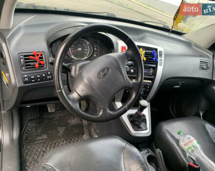 Черный Хендай Туксон, объемом двигателя 1.99 л и пробегом 290 тыс. км за 7700 $, фото 30 на Automoto.ua