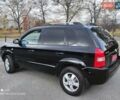 Черный Хендай Туксон, объемом двигателя 2 л и пробегом 237 тыс. км за 7999 $, фото 1 на Automoto.ua