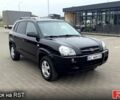 Черный Хендай Туксон, объемом двигателя 2 л и пробегом 200 тыс. км за 7800 $, фото 1 на Automoto.ua