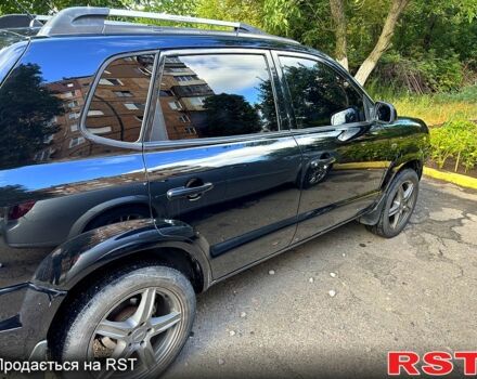 Черный Хендай Туксон, объемом двигателя 2 л и пробегом 18 тыс. км за 6900 $, фото 1 на Automoto.ua
