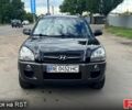 Черный Хендай Туксон, объемом двигателя 2 л и пробегом 192 тыс. км за 7700 $, фото 1 на Automoto.ua
