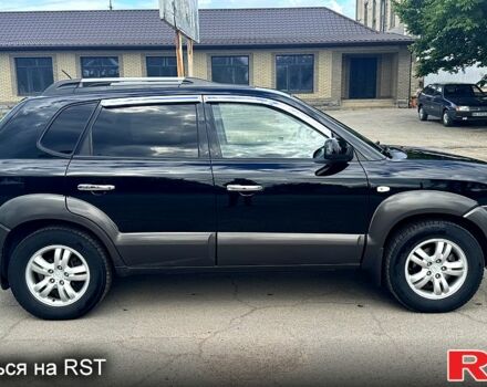 Черный Хендай Туксон, объемом двигателя 2 л и пробегом 192 тыс. км за 7700 $, фото 4 на Automoto.ua