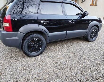 Черный Хендай Туксон, объемом двигателя 2.7 л и пробегом 290 тыс. км за 7300 $, фото 4 на Automoto.ua