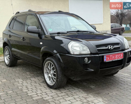Черный Хендай Туксон, объемом двигателя 1.98 л и пробегом 231 тыс. км за 7750 $, фото 1 на Automoto.ua