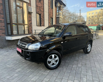 Черный Хендай Туксон, объемом двигателя 2 л и пробегом 249 тыс. км за 7450 $, фото 1 на Automoto.ua