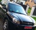Черный Хендай Туксон, объемом двигателя 2 л и пробегом 205 тыс. км за 7200 $, фото 6 на Automoto.ua
