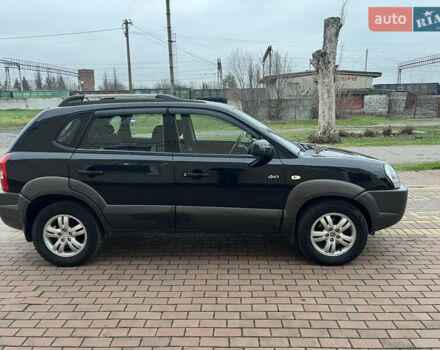 Черный Хендай Туксон, объемом двигателя 1.98 л и пробегом 227 тыс. км за 6900 $, фото 15 на Automoto.ua