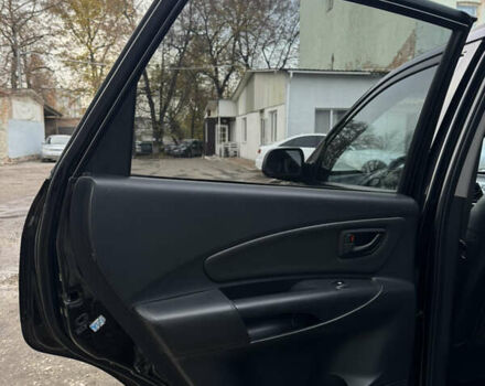 Черный Хендай Туксон, объемом двигателя 1.98 л и пробегом 198 тыс. км за 7500 $, фото 12 на Automoto.ua